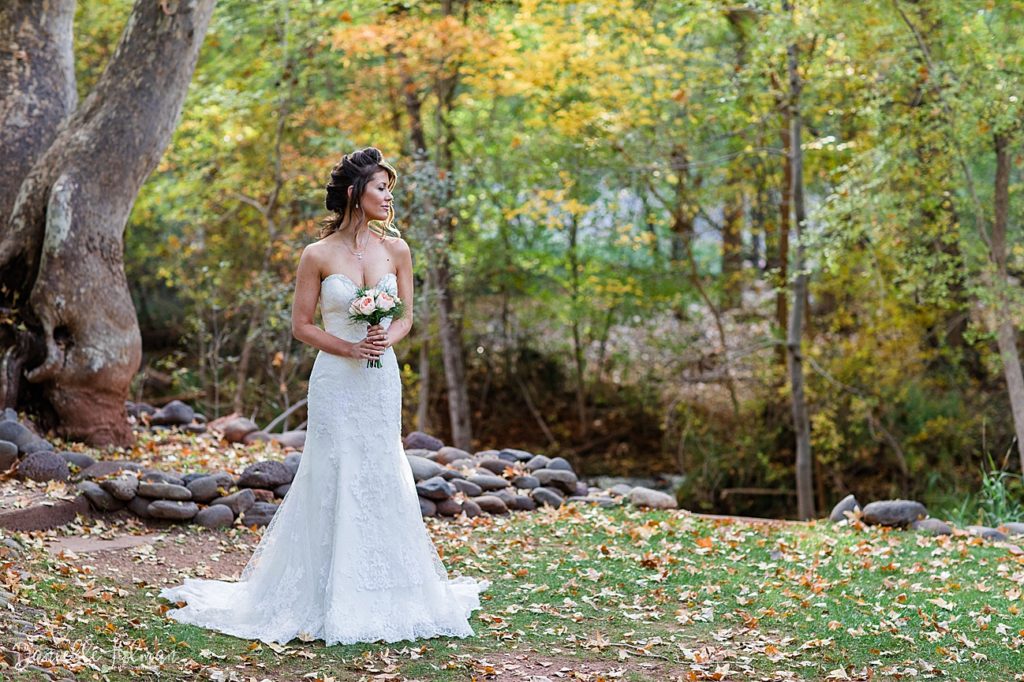 Bride at her fall Sedona elopement amongst colorful foliage