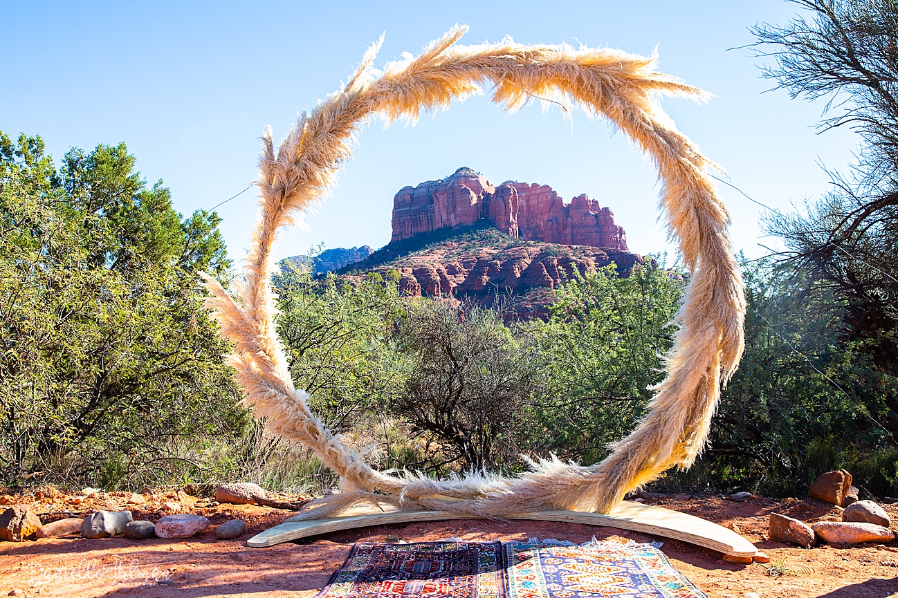 Beautiful pompous grass ring arch, framing Sedona's Cathedral rock