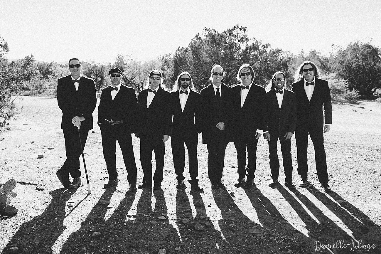 Black and white group portrait of the groom and groomsmen
